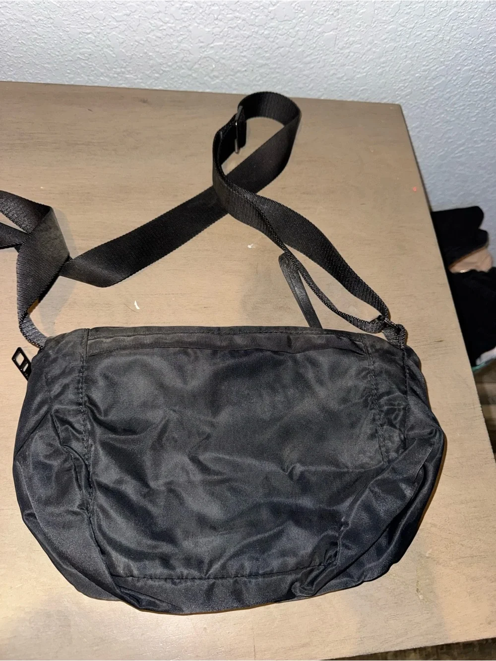 Lululemon Black Nylon Crossbody Bag with Fold-Over Flap and Front Zipper